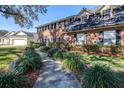 Landscaped walkway leading to the front entrance of a brick home at 5171 Deeson Pointe Ct, Lakeland, FL 33805