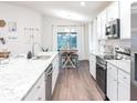 Spacious kitchen with stainless steel appliances and granite countertops at 555 Silver Course Run, Ocala, FL 34472