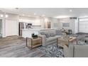 Open concept living area with kitchen and island at 557 Silver Course Run, Ocala, FL 34472