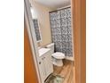 Clean bathroom with white vanity, shower, and modern flooring at 107 W 7Th St, Frostproof, FL 33843