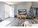 Living room with laminate flooring and Christmas tree at 1126 Lakewood W Cir, Lakeland, FL 33801