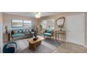 Bright living room featuring stylish furniture, neutral walls and tile floors at 1130 N Lake Parker Ave # A205, Lakeland, FL 33805