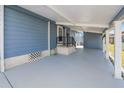 Covered patio with concrete flooring, providing extra outdoor space at 2206 Golden Horseshoe N Cir, Lakeland, FL 33810