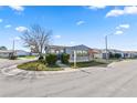 Mobile home on a corner lot with mature trees and manicured lawn at 2206 Golden Horseshoe N Cir, Lakeland, FL 33810