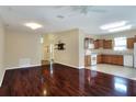 Spacious living area with hardwood floors and open kitchen view at 3710 Madbury Cir, Lakeland, FL 33810