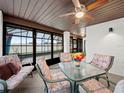 Bright sunroom with seating area and dining table, perfect for relaxing at 4032 Derby Dr, Lakeland, FL 33809