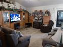 Spacious living room featuring comfortable seating and a built-in entertainment center at 6759 Ashbury Dr, Lakeland, FL 33809