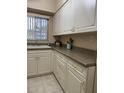 Well-equipped kitchen with ample cabinetry and counter space at 1700 6Th Nw St # C27, Winter Haven, FL 33881