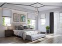 Elegant main bedroom featuring stylish decor, ample natural light, and chic furnishings for a serene retreat at 23 Lake Hollingworth, Lakeland, FL 33803