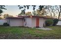 Home's rear with detached storage shed at 3018 Elm St, Winter Haven, FL 33881