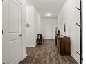 Bright and spacious entryway with dark hardwood floors at 4710 Osprey Way, Winter Haven, FL 33881