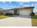 Low-maintenance exterior with a large driveway at 4710 Osprey Way, Winter Haven, FL 33881