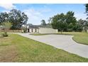 Aerial view showcasing the house, expansive yard, and swimming pool at 6126 Wendel Way, Lakeland, FL 33813