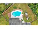 Aerial view of the house, pool, and surrounding landscape at 6126 Wendel Way, Lakeland, FL 33813