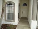 Front entry with door and window at 6824 Bendelow Dr, Lakeland, FL 33810