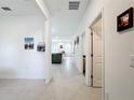 Bright hallway with tile floors and access to living areas and bedrooms at 812 Del Prado Dr, Kissimmee, FL 34758