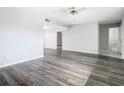 Spacious living room featuring wood-look floors and neutral walls at 1130 N Lake Parker Ave # A302, Lakeland, FL 33805