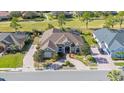 Luxury home with circular driveway and a view of the golf course at 1217 Vista Hills Dr, Lakeland, FL 33813