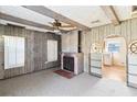 Living room with fireplace and built in shelving at 127 Colonial Dr, Auburndale, FL 33823