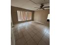 Large bedroom with tile flooring and two windows at 1408 28Th Nw St, Winter Haven, FL 33881