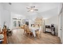 Spacious dining area with hardwood floors and view to entryway at 1423 Royal Forest Loop, Lakeland, FL 33811