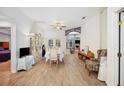 Bright dining room with hardwood floors and access to the kitchen at 1423 Royal Forest Loop, Lakeland, FL 33811