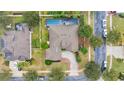 Aerial view showing a house with a pool and surrounding neighborhood at 178 Magneta Loop, Auburndale, FL 33823