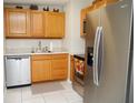 Bright kitchen featuring stainless steel appliances and wood cabinets at 1914 Alexander Dr, Lakeland, FL 33803