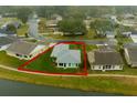 Property located on a canal with a lush green yard at 2266 Silver Re Dr, Lakeland, FL 33810