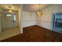 Bright dining area with wood-look flooring and chandelier at 2290 Silver Re Dr, Lakeland, FL 33810