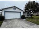 Front view of a single story house with a garage at 2290 Silver Re Dr, Lakeland, FL 33810