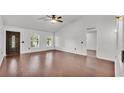 Bright living room with hardwood floors and ceiling fan at 3445 Sleepy Hill Oaks St, Lakeland, FL 33810