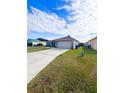 Exterior view showing a house, driveway, and lawn at 351 Cloverdale Rd, Winter Haven, FL 33884