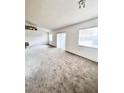 Bright living room featuring carpeted floors at 351 Cloverdale Rd, Winter Haven, FL 33884