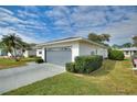 Single-story home with an attached garage and well-manicured landscaping at 3618 Highland Fairways Blvd, Lakeland, FL 33810