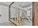 Modern entryway with a unique geometric mirror feature at 4003 Solamor St, Lakeland, FL 33810