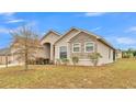 House exterior with stone accents and landscaping at 4236 Dinner Lake St, Lake Wales, FL 33859