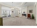 Bright dining room with carpeted floor and view to living area at 4308 Whistlewood Cir, Lakeland, FL 33811