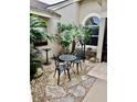 Relaxing courtyard with seating area and tropical plants at 4435 Fairway Oaks Dr, Mulberry, FL 33860