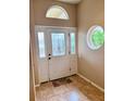 Interior entryway with tile flooring and arched windows at 4435 Fairway Oaks Dr, Mulberry, FL 33860