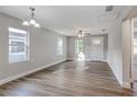 Bright living room with hardwood floors, ceiling fan, and lots of natural light at 638 W Thomas St, Lakeland, FL 33805