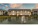 Townhome community with pond and fountain views at 649 Grasslands Village Cir, Lakeland, FL 33803