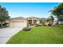 One-story house with a large front yard and palm trees at 6550 Evergreen Park Dr, Lakeland, FL 33813