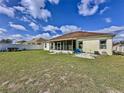 Large backyard with screened patio, providing ample outdoor space at 8 Sawfish Ln, Kissimmee, FL 34759