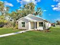 Charming craftsman style home with a landscaped yard at 825 S Seminole Ave, Fort Meade, FL 33841