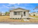 Updated home exterior showcasing a fresh coat of paint and landscaping at 865 S 9Th Ave, Bartow, FL 33830