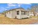 Side view of a charming newly renovated home with a well-maintained lawn at 865 S 9Th Ave, Bartow, FL 33830