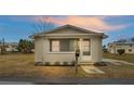 Front view of a recently updated home with a neat lawn at 865 S 9Th Ave, Bartow, FL 33830