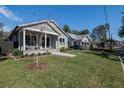 Attractive homes on a street featuring a manicured lawns and inviting front porches at 127 W Belmar St, Lakeland, FL 33803