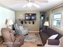 Living room with two recliners and a flat-screen TV at 1540 Skyview Ct, Lakeland, FL 33801